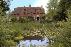 The Manor House at Pekes. A view from across the lake.