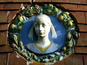 The Oast House on the Pekes Manor Estate. One of the decorative plaster plaques on the exterior walls. 