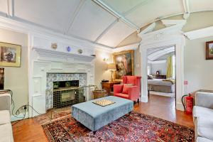 The Wing at Pekes Manor - The Living Room area with Woodburner.